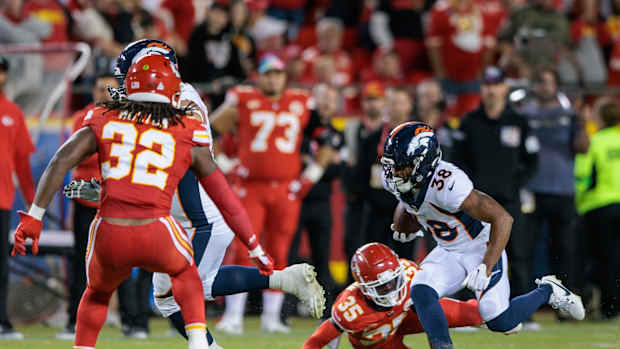 Denver Broncos running back Jaleel McLaughlin (38) runs the ball during the third quarter against the Kansas City Chiefs at GEHA Field at Arrowhead Stadium.